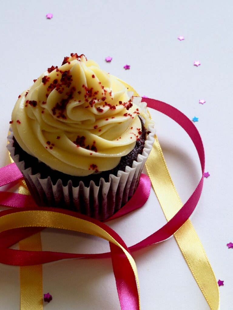 Chocolate Cupcake With White and Red Toppings